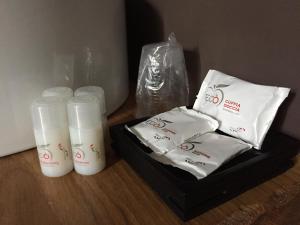 a group of plastic cups and towels on a table at Itaka in LʼAquila