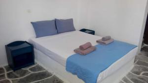 Posteľ alebo postele v izbe v ubytovaní Lagada Beach Economy