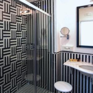 a bathroom with a shower and a sink at Hotel Montemare in Positano
