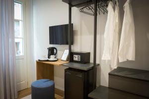 TV a/nebo společenská místnost v ubytování Trieste 411 - Rooms & Apartments