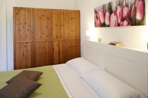 Een bed of bedden in een kamer bij Appartamento La Vista by Holiday Solutions