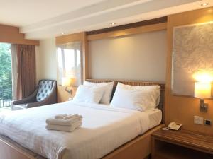 Ένα ή περισσότερα κρεβάτια σε δωμάτιο στο Kitlada Hotel Udonthani