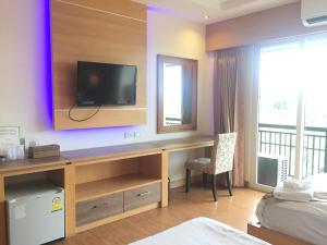 Ένα ή περισσότερα κρεβάτια σε δωμάτιο στο Kitlada Hotel Udonthani