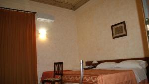 Postel nebo postele na pokoji v ubytování Hotel Gresi