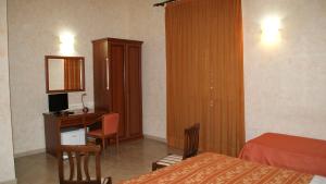 Postel nebo postele na pokoji v ubytování Hotel Gresi