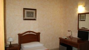 Postel nebo postele na pokoji v ubytování Hotel Gresi
