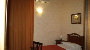 Postel nebo postele na pokoji v ubytování Hotel Gresi