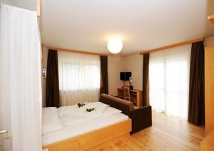 Postel nebo postele na pokoji v ubytování Hotel Jasmin