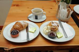 a table with two plates of food and a cup of coffee at Lodge at The Old Barracks in Athenry