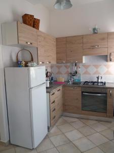 Appartamento Castelduranteにあるキッチンまたは簡易キッチン