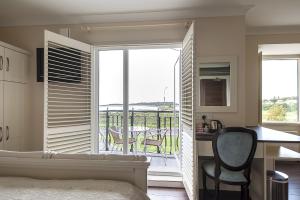 a bedroom with a bed and a window at Sea Breeze Lodge B&B in Galway