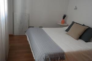 Ένα ή περισσότερα κρεβάτια σε δωμάτιο στο Penthouse Apartment & Pool Malaga Center +24 φωτογραφίες