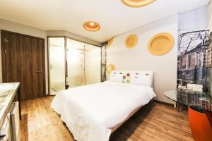 Posteľ alebo postele v izbe v ubytovaní Q Hotel Yongin