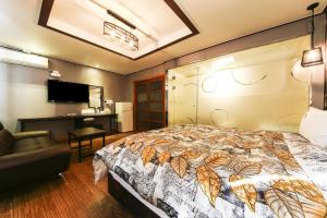Posteľ alebo postele v izbe v ubytovaní Q Hotel Yongin