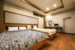 Posteľ alebo postele v izbe v ubytovaní Q Hotel Yongin
