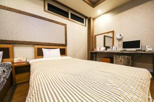 Posteľ alebo postele v izbe v ubytovaní Q Hotel Yongin