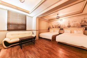 Posteľ alebo postele v izbe v ubytovaní Q Hotel Yongin