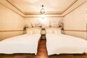 Posteľ alebo postele v izbe v ubytovaní Q Hotel Yongin