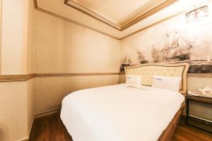 Posteľ alebo postele v izbe v ubytovaní Q Hotel Yongin