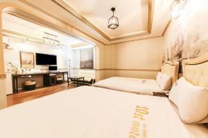 Posteľ alebo postele v izbe v ubytovaní Q Hotel Yongin
