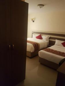 Mara Frontier Hotel客房内的一张或多张床位