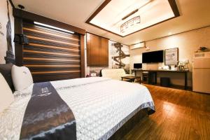 Posteľ alebo postele v izbe v ubytovaní Q Hotel Yongin