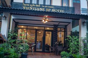 a restaurant with a sign that reads vienayan sp hotel at Vientiane SP Hotel in Vientiane