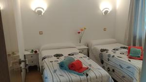 Кровать или кровати в номере Apt Cardoso 3 ao lado da Praia Peneco