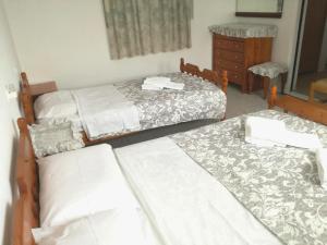 
A bed or beds in a room at 160 m2 village house "Arkadi"
