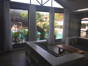 a living room with a couch and a table at Bella Vista Resort in Naguilian
