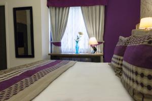 Postel nebo postele na pokoji v ubytování LV Hoteles Boutique