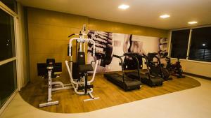 a gym with several exercise bikes in a room at Apartamento Ilhéus - Vog Sul in Ilhéus