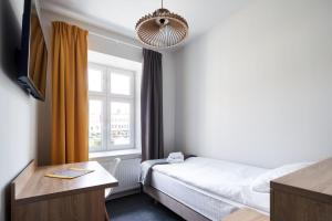 Łóżko lub łóżka w pokoju w obiekcie Polin House