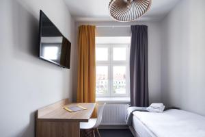 Łóżko lub łóżka w pokoju w obiekcie Polin House