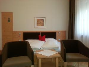 Postel nebo postele na pokoji v ubytování Hotel Jasmin