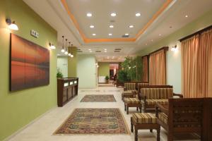 a hospital hallway with chairs and a waiting room at Villa Belles in Akritochori