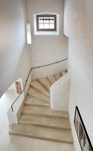 a staircase in a house with a window at Hotel Kleis in Cvikov