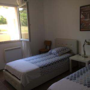 Ένα ή περισσότερα κρεβάτια σε δωμάτιο στο Lou Badabeu