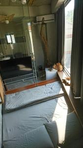 Postel nebo postele na pokoji v ubytování Pin Shiuan Inn