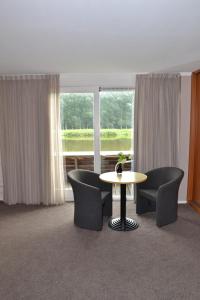 Area soggiorno di Fletcher Hotel - Resort Spaarnwoude
