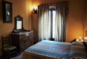 Postel nebo postele na pokoji v ubytování Agriturismo La Grotta Di Montecchino