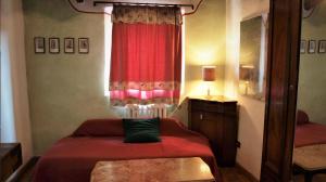 Postel nebo postele na pokoji v ubytování Agriturismo La Grotta Di Montecchino
