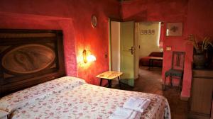 Postel nebo postele na pokoji v ubytování Agriturismo La Grotta Di Montecchino