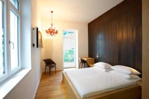 Postel nebo postele na pokoji v ubytování Boutique Hotel Imperialart