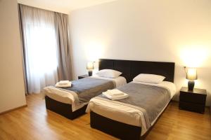 Ένα ή περισσότερα κρεβάτια σε δωμάτιο στο Hotel Chubu
