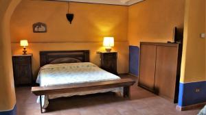 Postel nebo postele na pokoji v ubytování Agriturismo La Grotta Di Montecchino