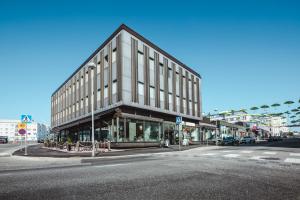 a large building on the corner of a street at Hostel Café Koti in Rovaniemi