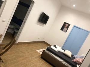 TV a/nebo společenská místnost v ubytování Casa Vacanze Riva Destra