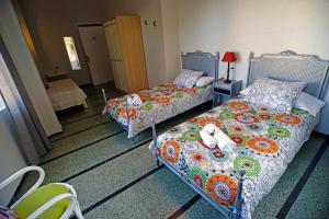 Postel nebo postele na pokoji v ubytování Casa Kilig