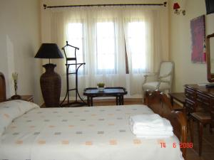 מיטה או מיטות בחדר ב-Smaragdi Luxury Apartments